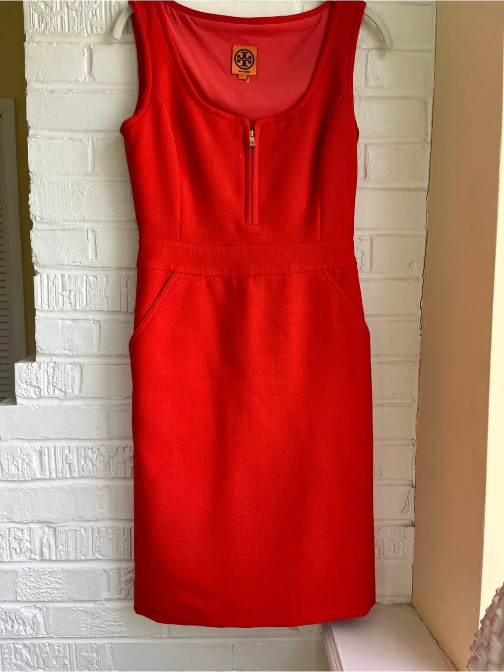 Tory Burch Bright Orange Sleeveless Zip-Front Midi Dress with pockets.